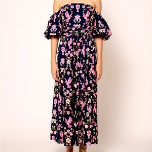 The flirty and glamorous off the shoulder bubble sleeves, a fitted waist